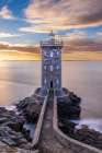 France-Brittany-Le Conquet Sun setting at the Kermorvan Lighthouse Art Print
